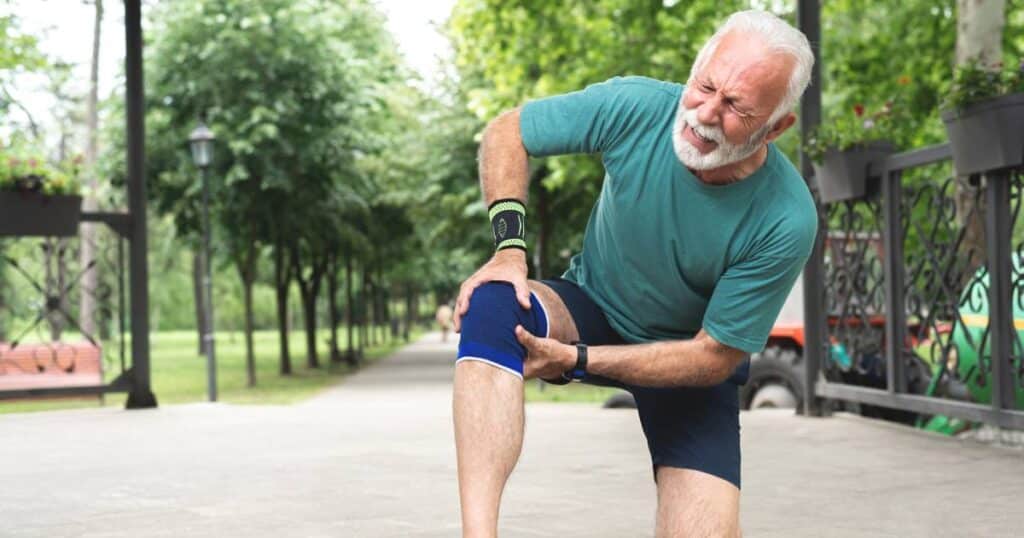 Man holding on to his knee in pain. He is looking for ketamine for chronic pain in San Antonio, Texas.